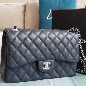 Jumbo navy blue Chanel cavalier handbag